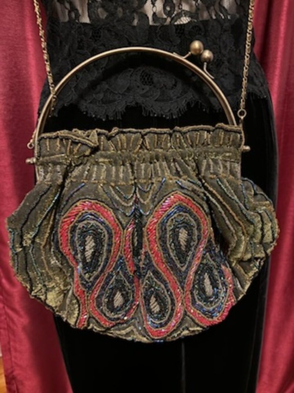 Beaded handbag with metal handles and optional shoulder chain